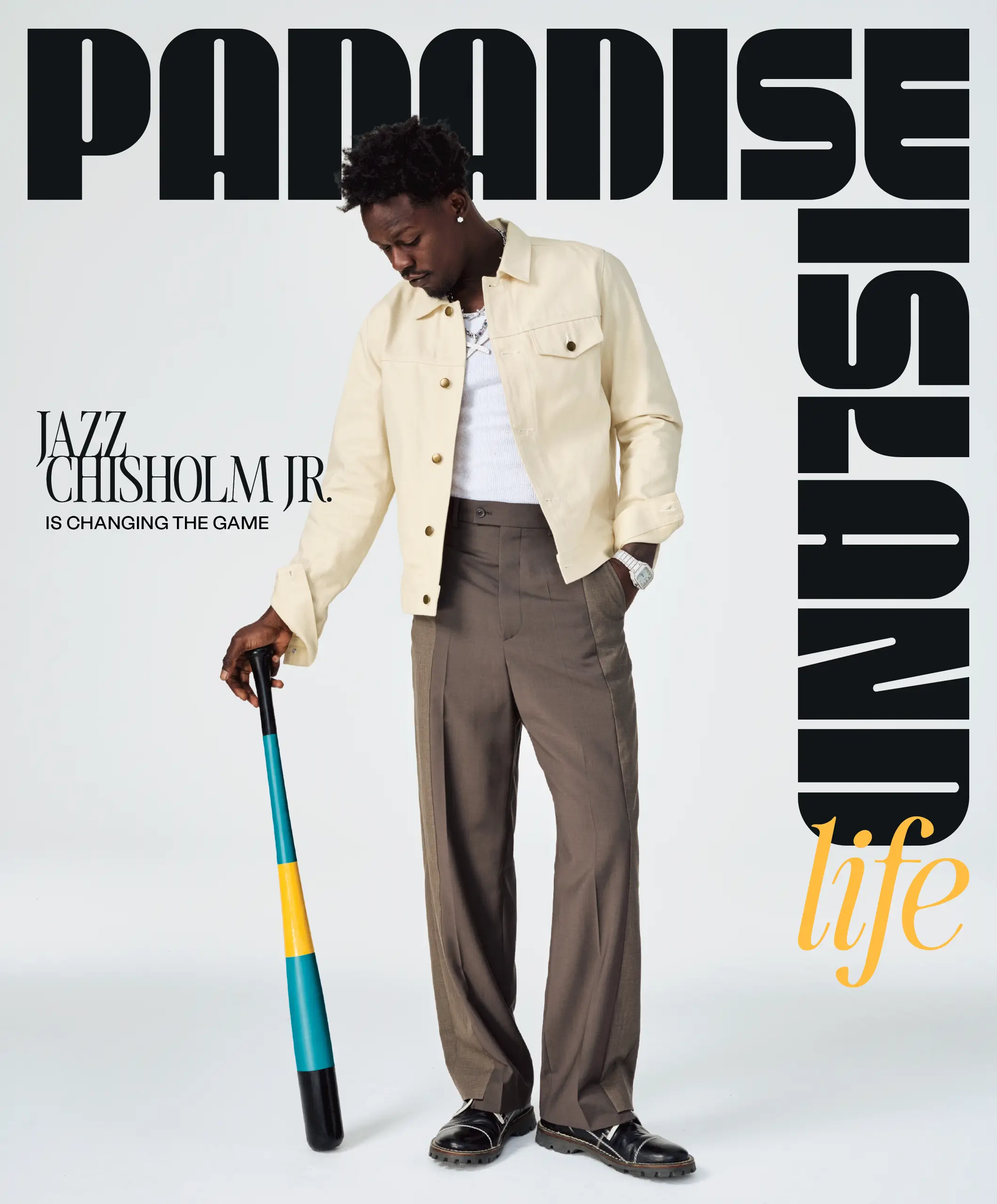 Jazz Chisholm stands holding a bat painted in the colors of the Bahamas.