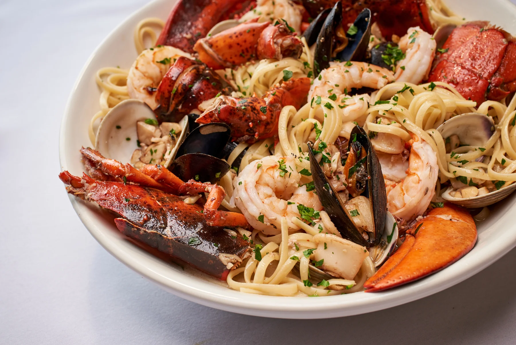 A family-style seafood pasta at Carmine's