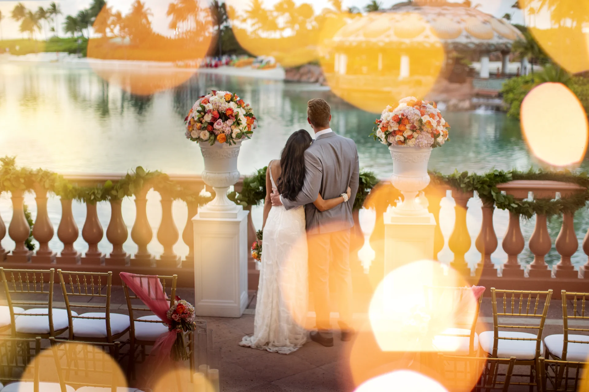 A couple overlooking Paradise Lagoon from the Dragon's Patio at Atlantis
