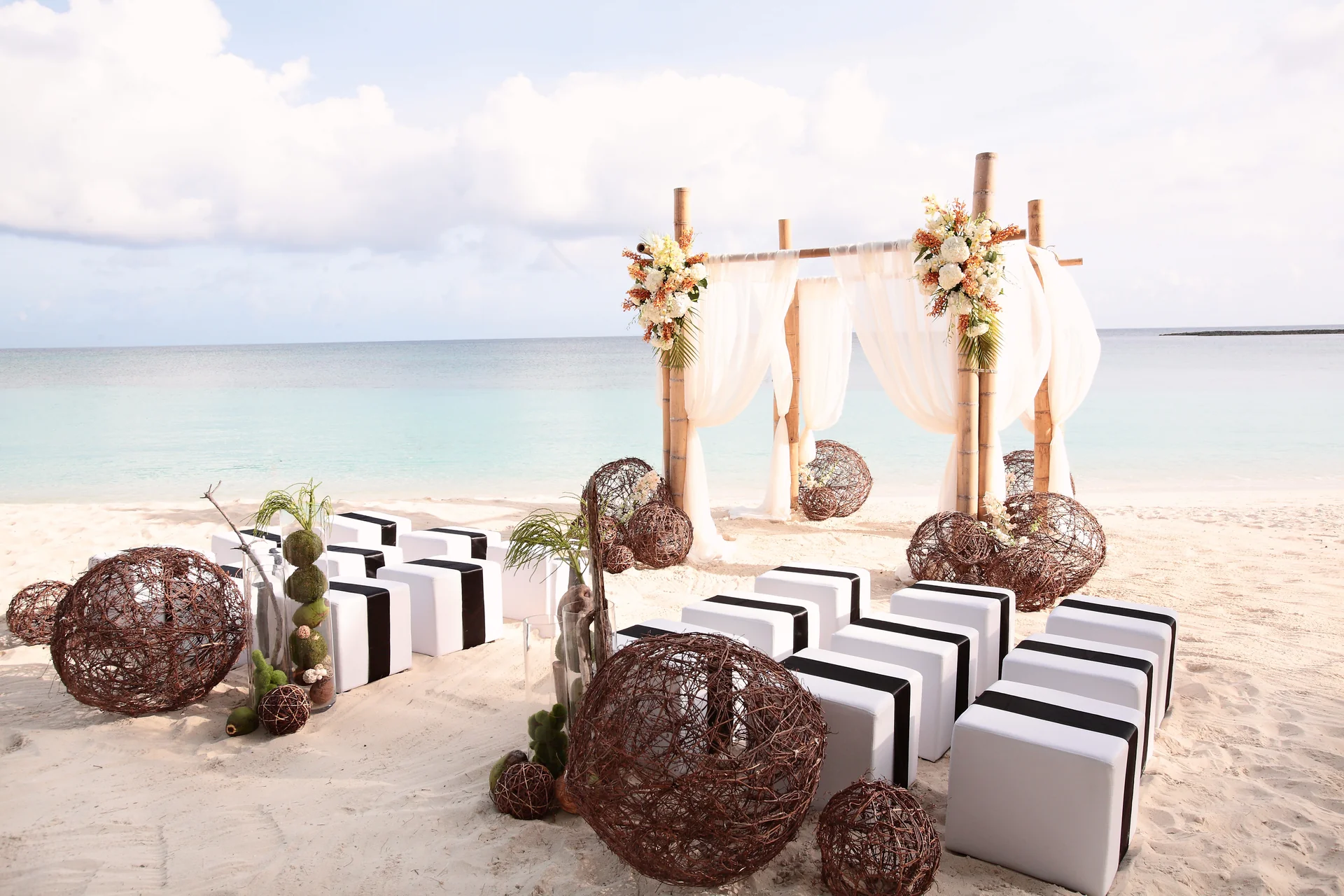 A beach ceremony setup at The Ocean Club, A Four Seasons Resort